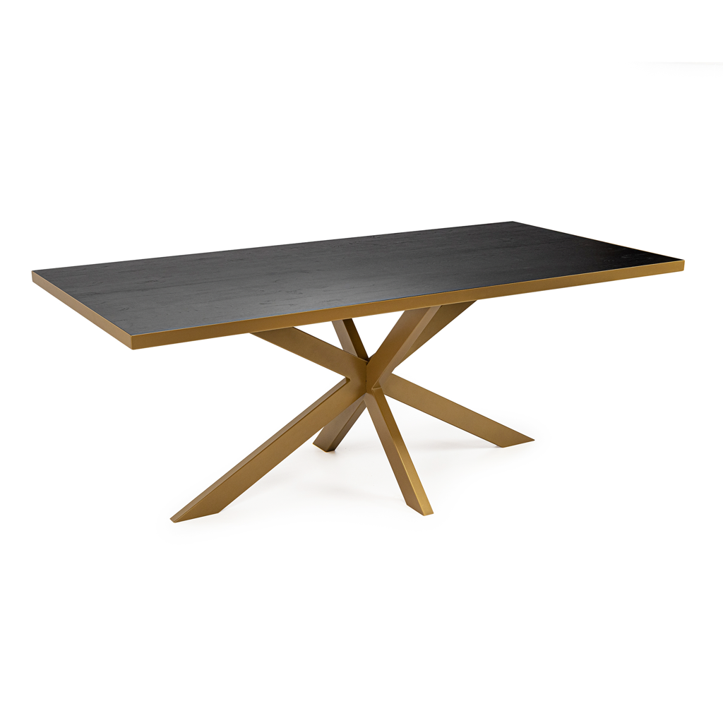 Moderne tafel met een donker houten blad en een goudkleurig metalen kruisvormige pootconstructie.